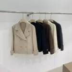 1ccfd5cf-6200-424a-bac5-591ac0a42ddf.webp Elegant Women’s Wool Coat with Button Detail and 3 D Pattern