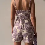 778997b0-1b4f-4f5a-b7da-8f48fd58e61a.webp Floral Pleated Polyester Romper with Adjustable Rope Waist