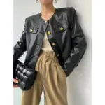 7e8cd6d9-358f-44b0-81fa-986745b84f53.webp Sleek Black Faux Leather Cardigan Jacket, Round Neck Fit