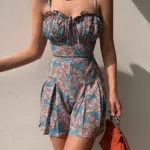 9cd6d517-4ff9-40c2-9c73-9a262bed1069.webp Floral Pleated Polyester Romper with Adjustable Rope Waist