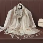 b09fce7a-48a4-4740-b236-19cffe9af346.webp Breathable Apricot Jacquard Tassel Shawl for Sun Protection