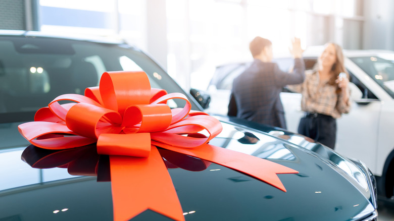 Bow on hood of car in dealership